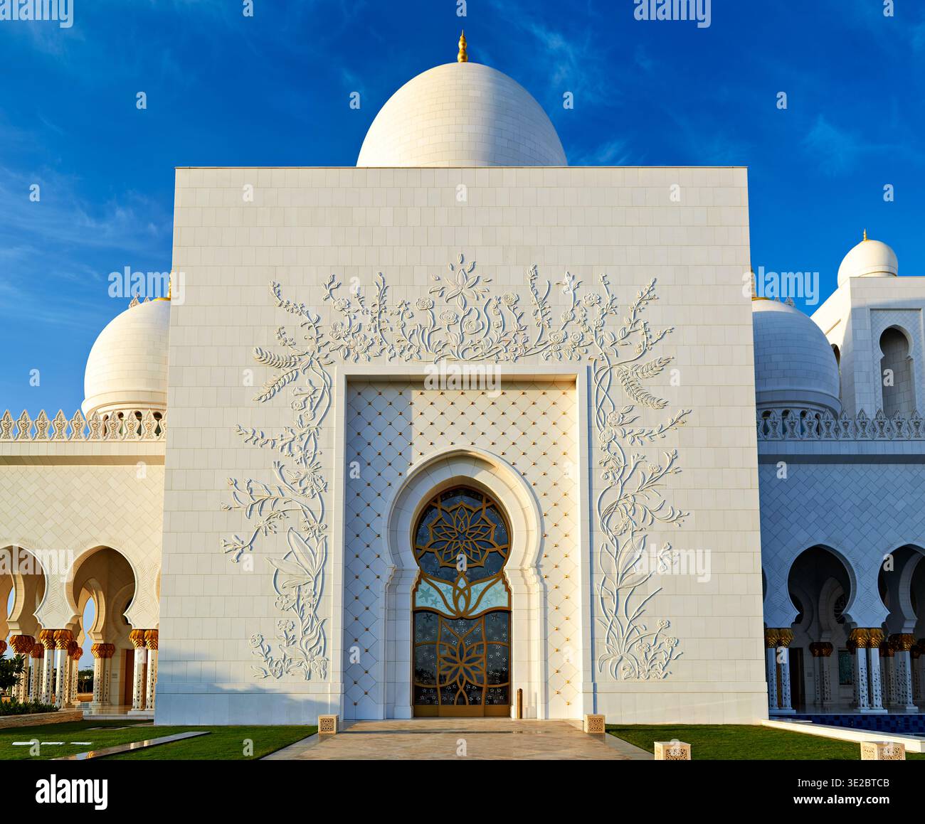 Unique Shape Mosque People visit the Sheikh Zayed Grand Mosque in Abu Dhabi during the day ...