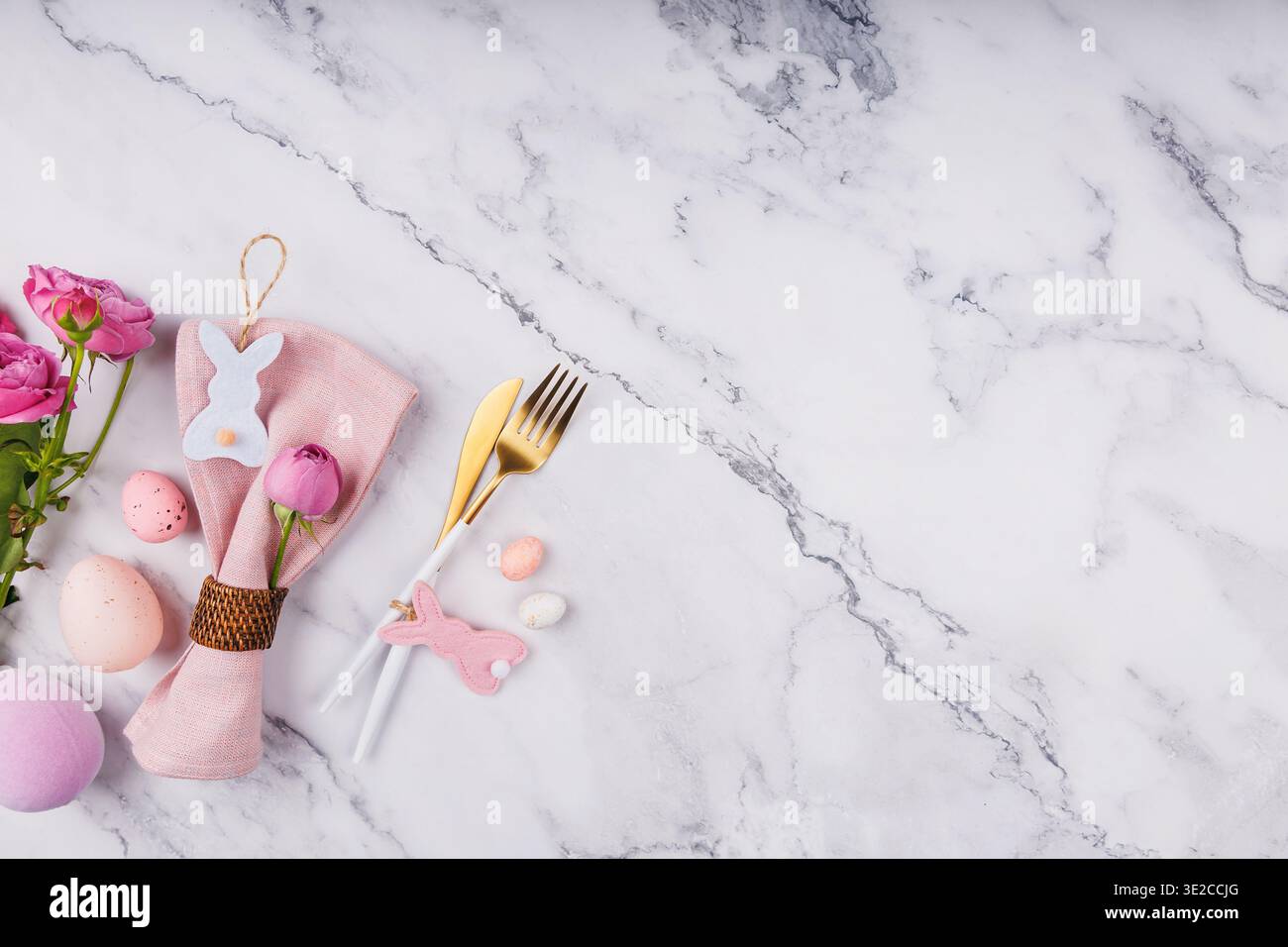 Flat Lay of Easter Table Setting and Spring Flowers Stock Photo