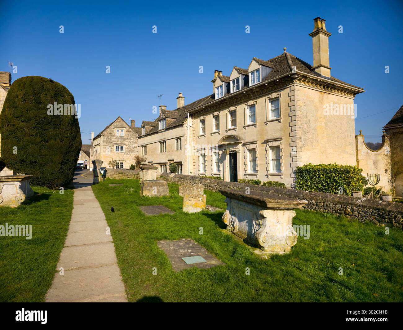 St Mary's Church Spire with Iconic Yew Trees in Churchyard, Painswick, Cotswolds, Gloucestershire, England - Smartphone Captured Stock Image
