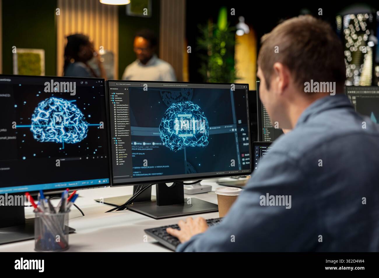 System administrator in tech startup office automating repetitive tasks using AI scripts on PC. IT expert using artificial intelligence application on computer to speed up feature implementation Stock Photo
