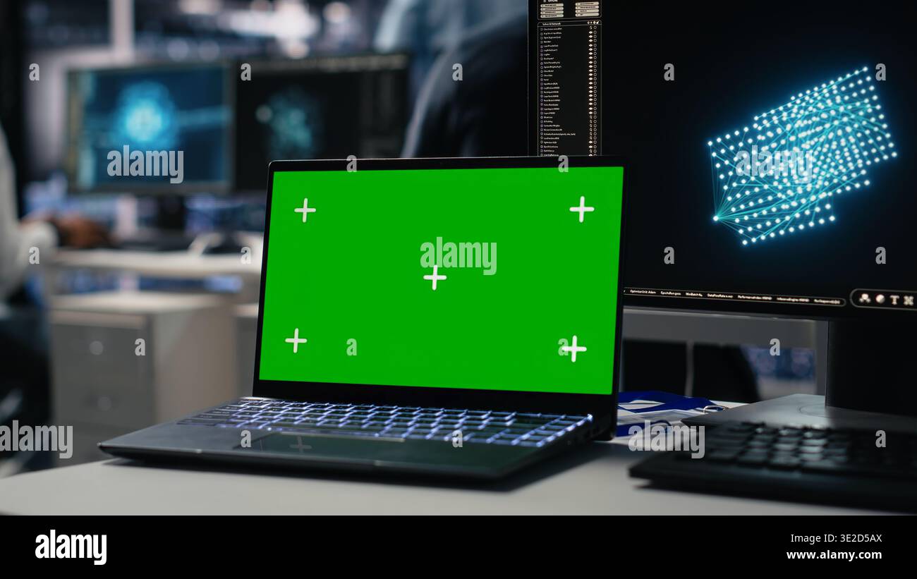 Data center engineer working on neural network software development on chroma key laptop. Server room IT specialist implementing machine learning technology using isolated screen notebook, camera A Stock Photo