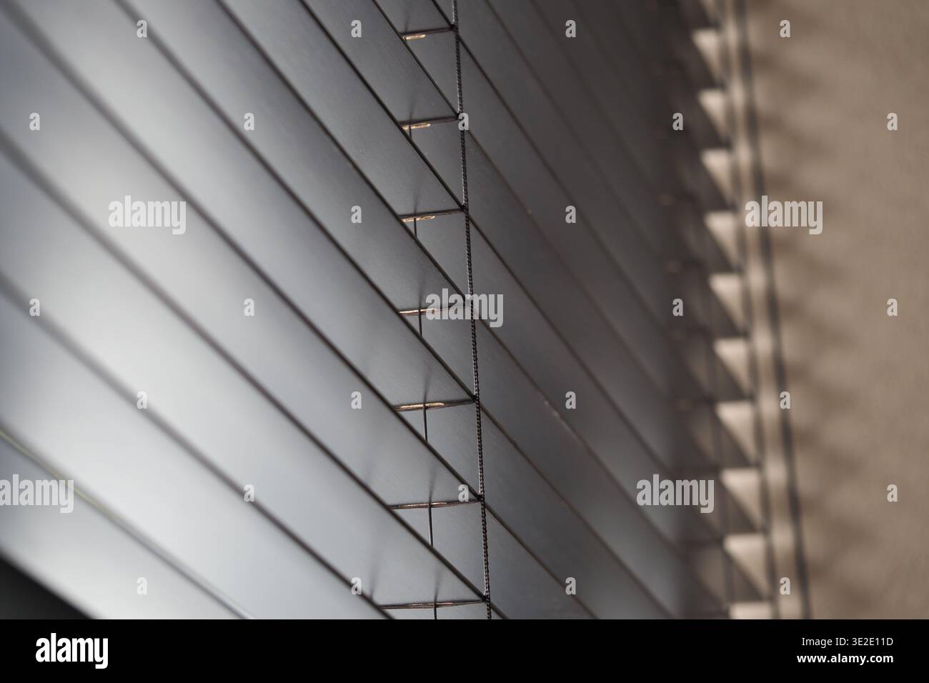Light filtering through window blinds at home Stock Photo