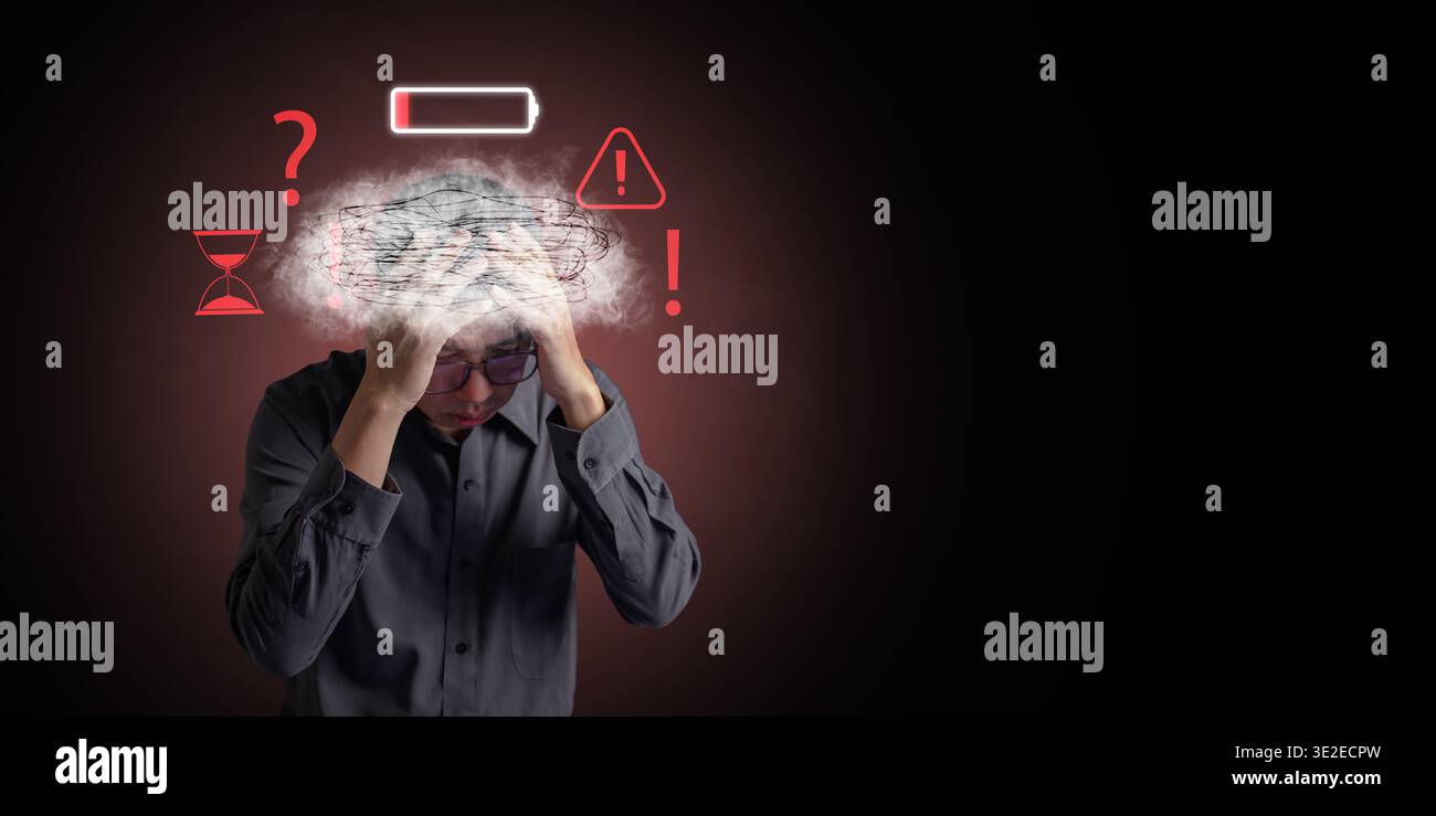 Mental health burnout concept. A stressed man with brain fog, low battery, hourglass, warning icons. Stress management, depression, fatigue, being ove Stock Photo