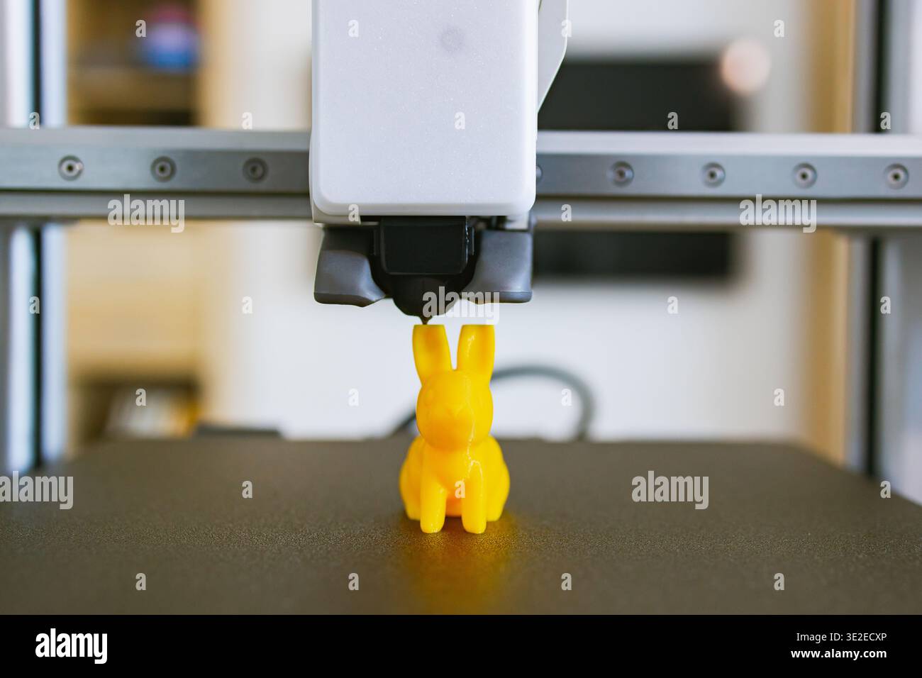3D Printer Creating Yellow Bunny Stock Photo
