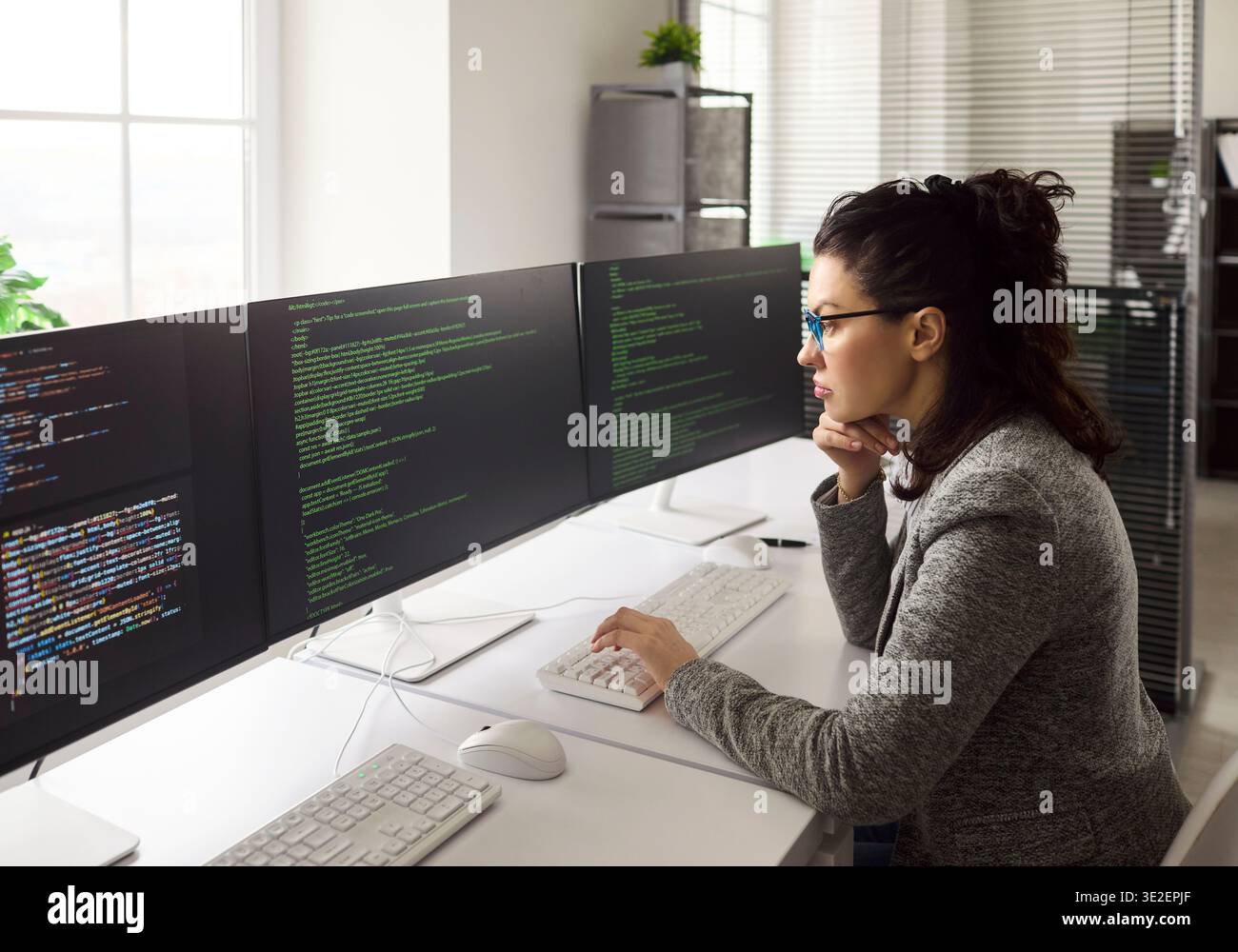 Software Engineering On Monitor Triple monitor setup hi-res stock photography and images - Alamy