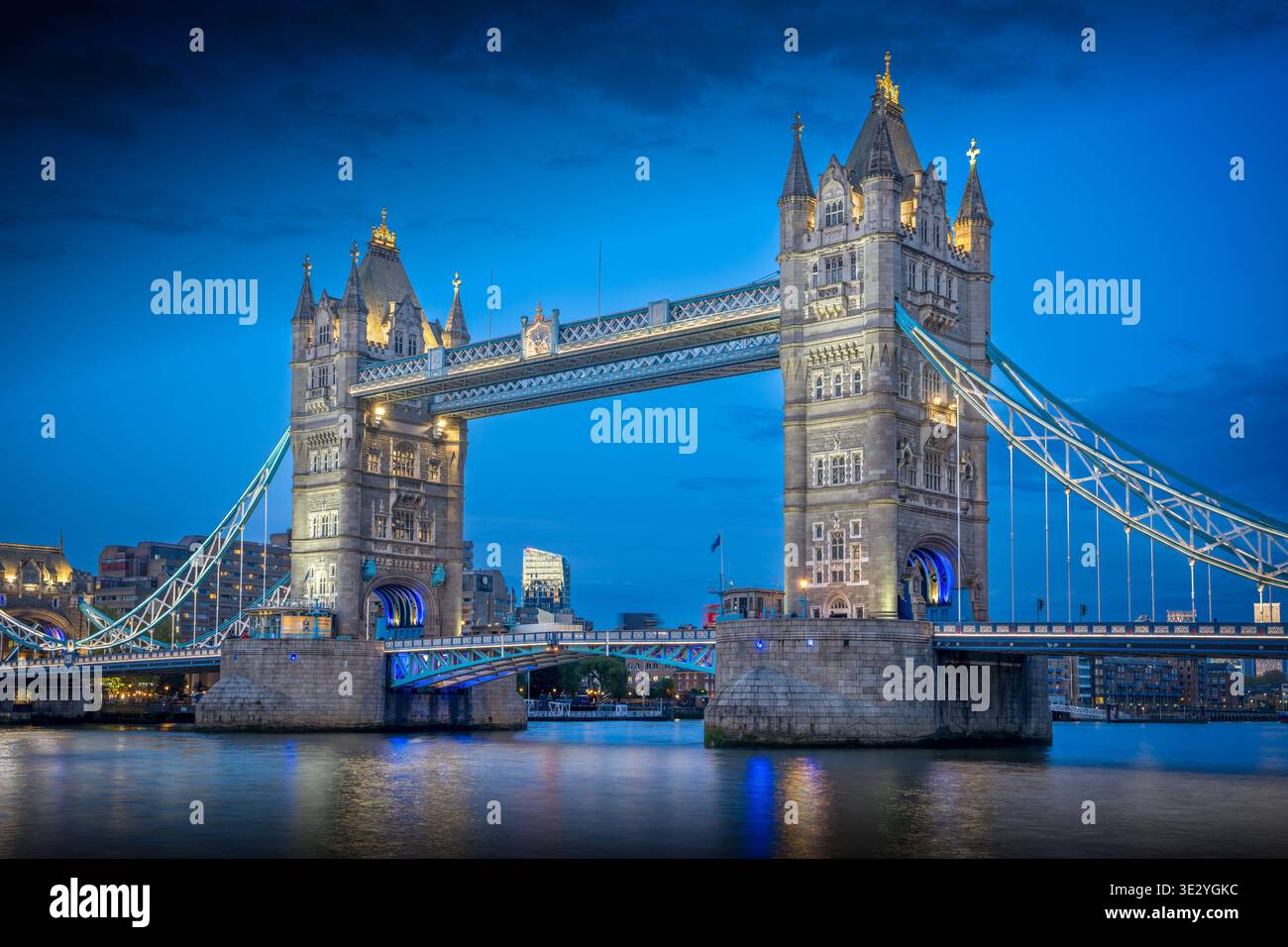 Tower Bridge London at Blue Hour with City Lights Stock Photo