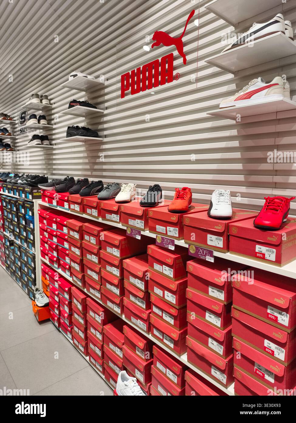 Puma shop interior sneakers display hi-res stock photography and