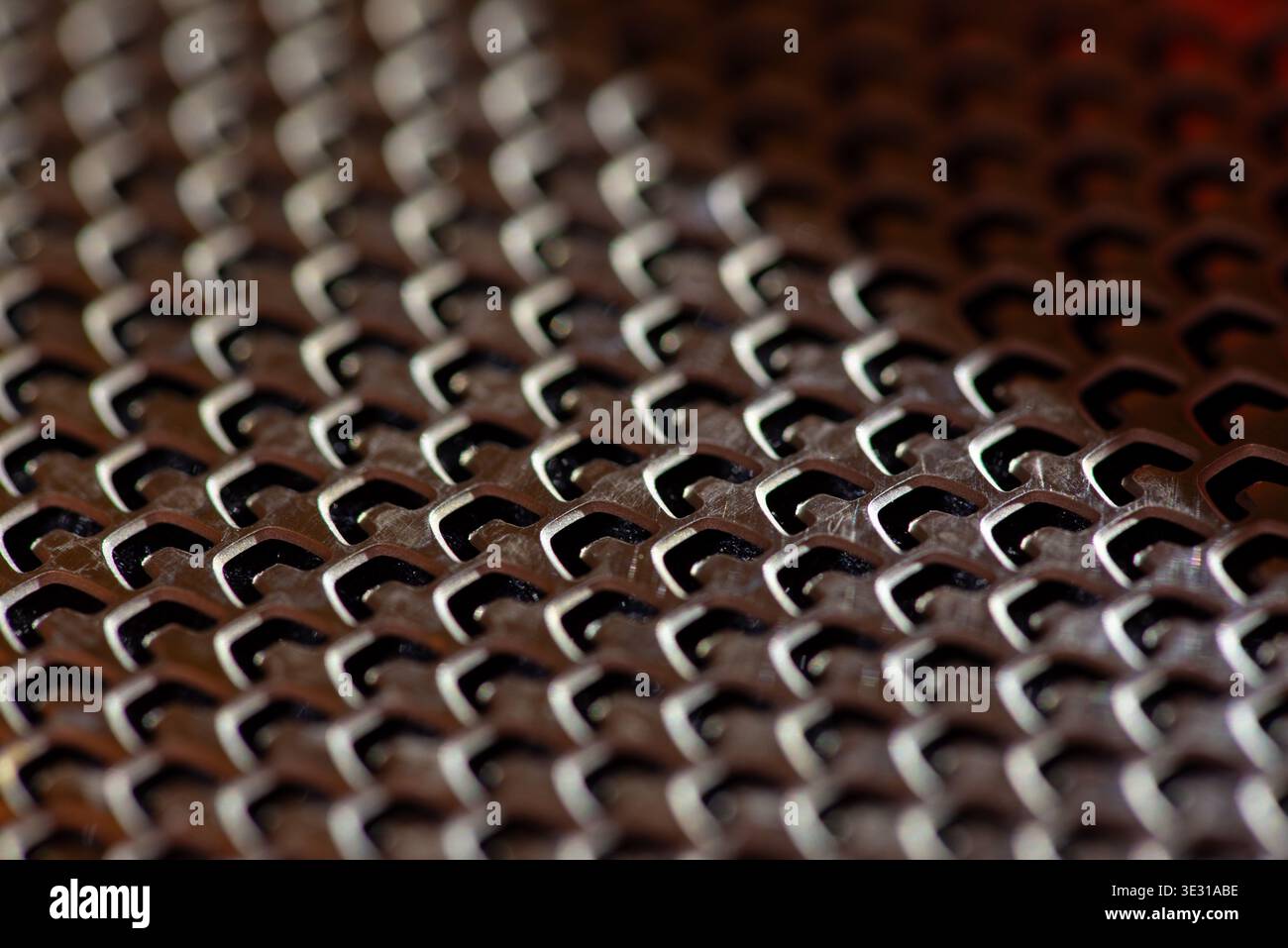 Abstract metal grid texture with repeating geometric pattern Stock Photo