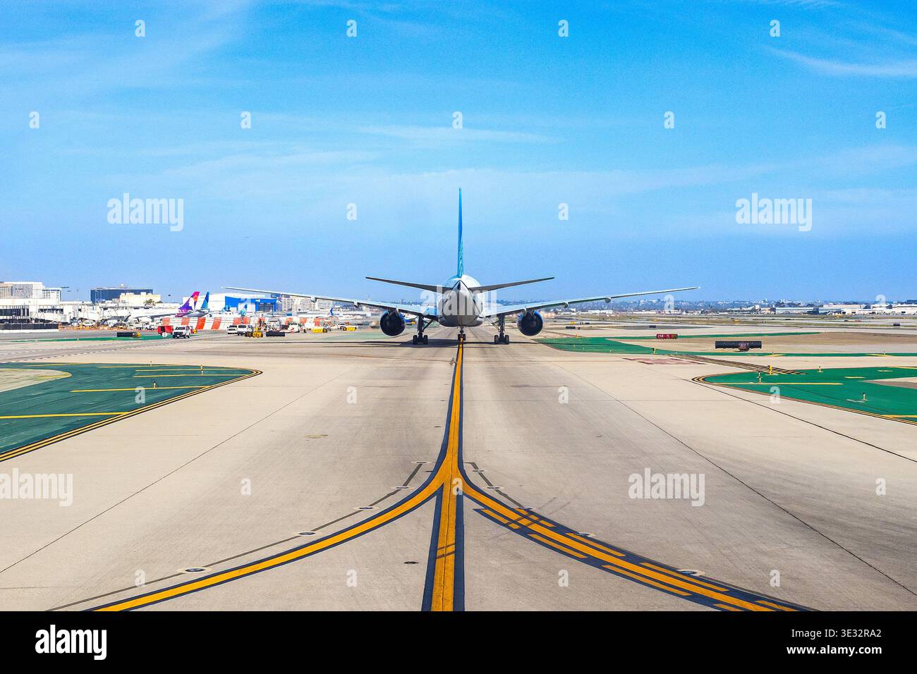 Plane Taking Off Rear View Plane on an airport runway rear view taking off or taxiing for takeoff ...