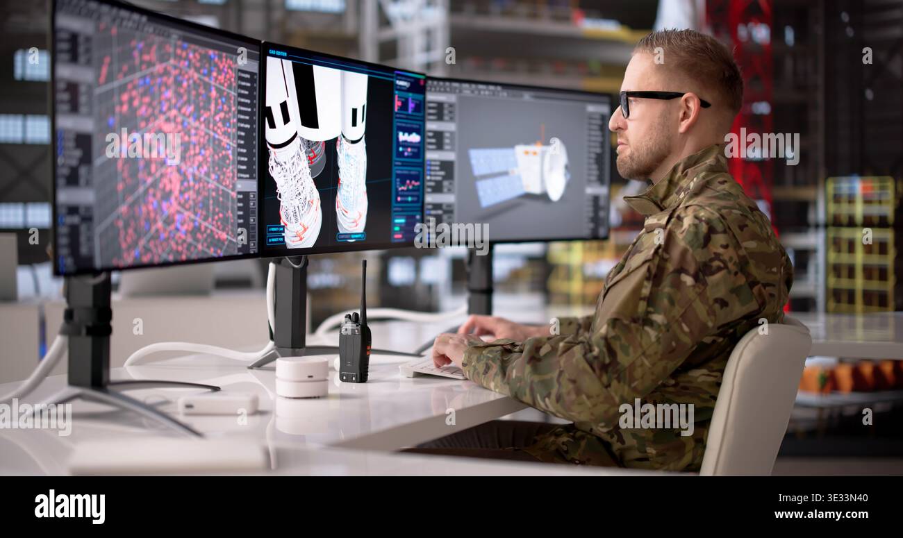 Rocket Engineer Analyzes Industrial Computer Systems At Workstation, Focused On Engineering And Security Stock Photo