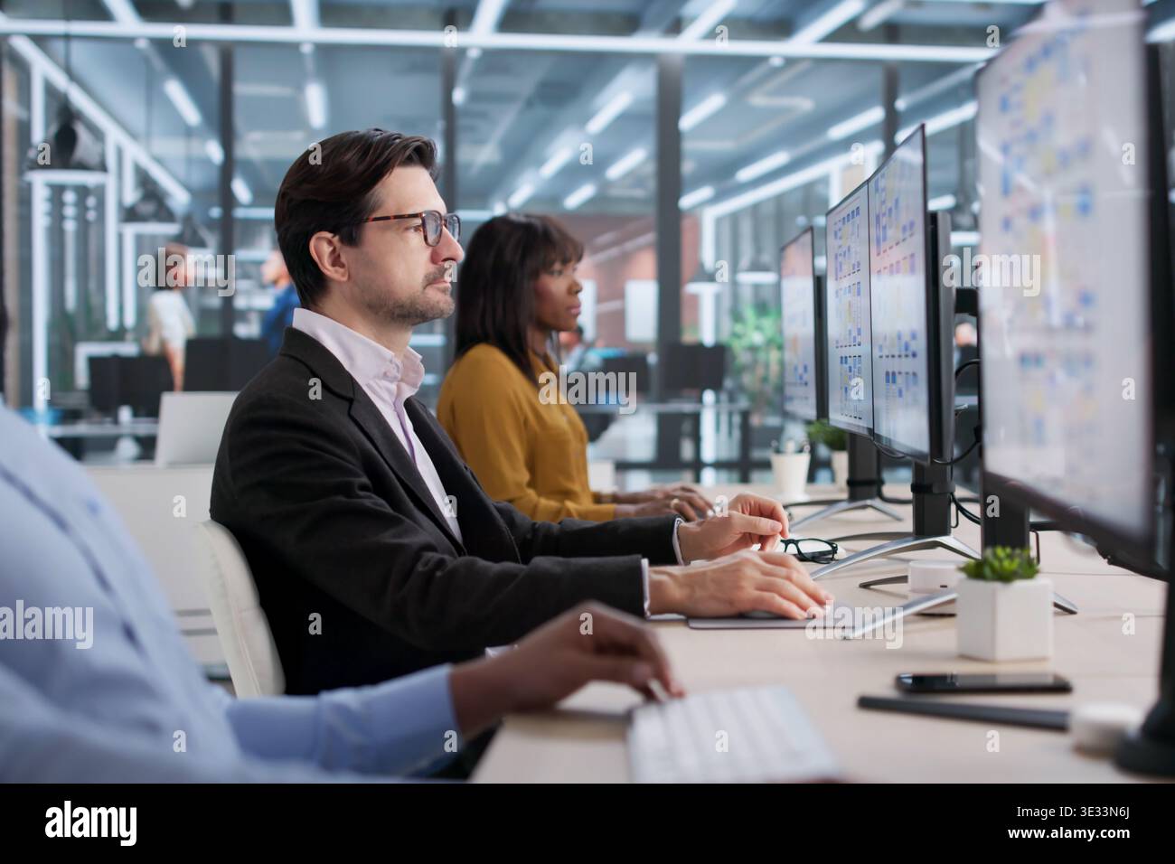 Young Designer And Developer Collaborating On App Interface Design. People Working Together On User Experience Stock Photo