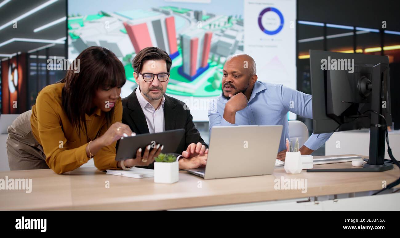 Diverse Design Team Using GIS Software Maps Urban Land For Construction. Young Engineers Work On 3D Models Stock Photo