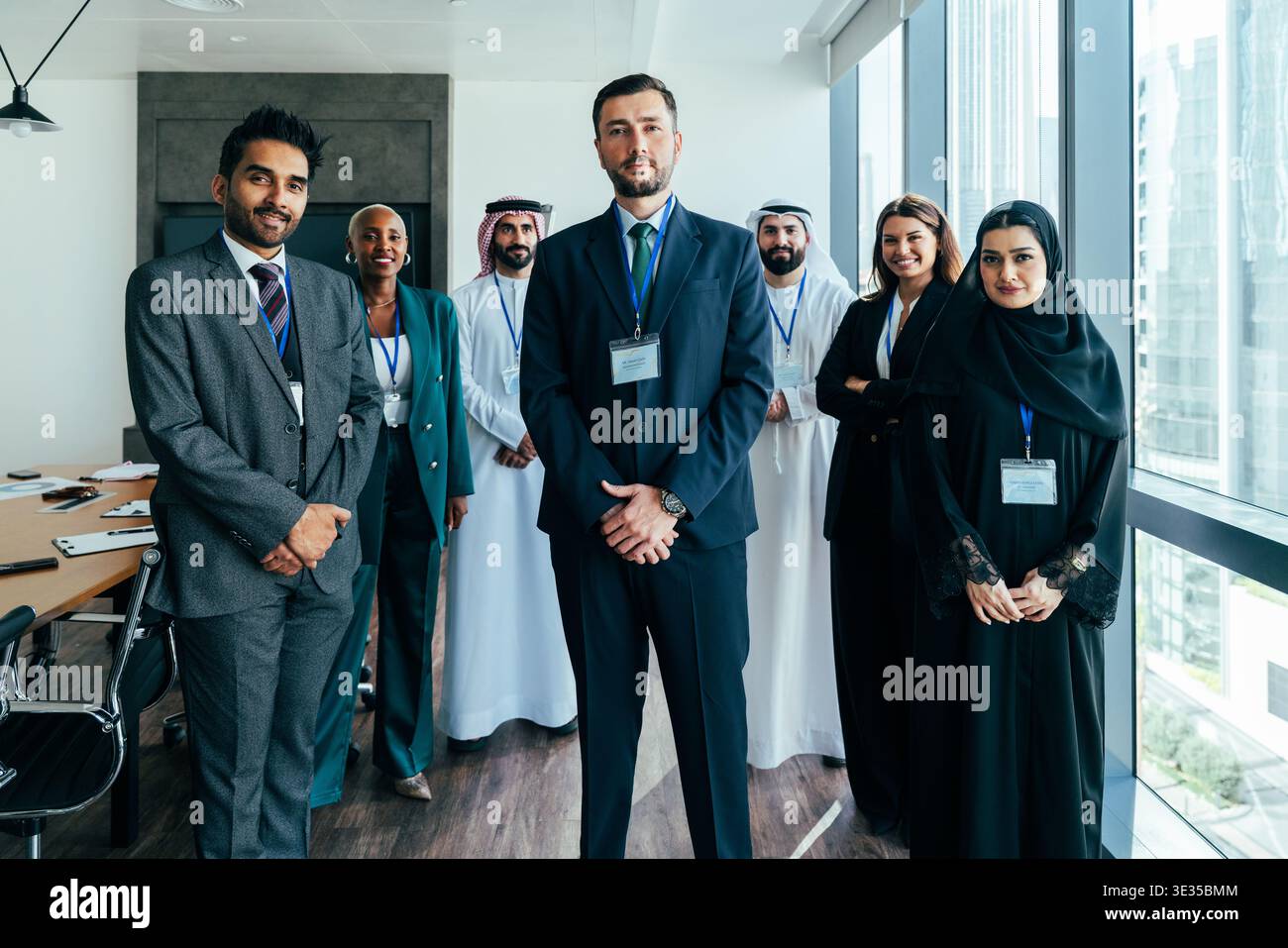 Diverse multinational business team in formal and traditional attire ...