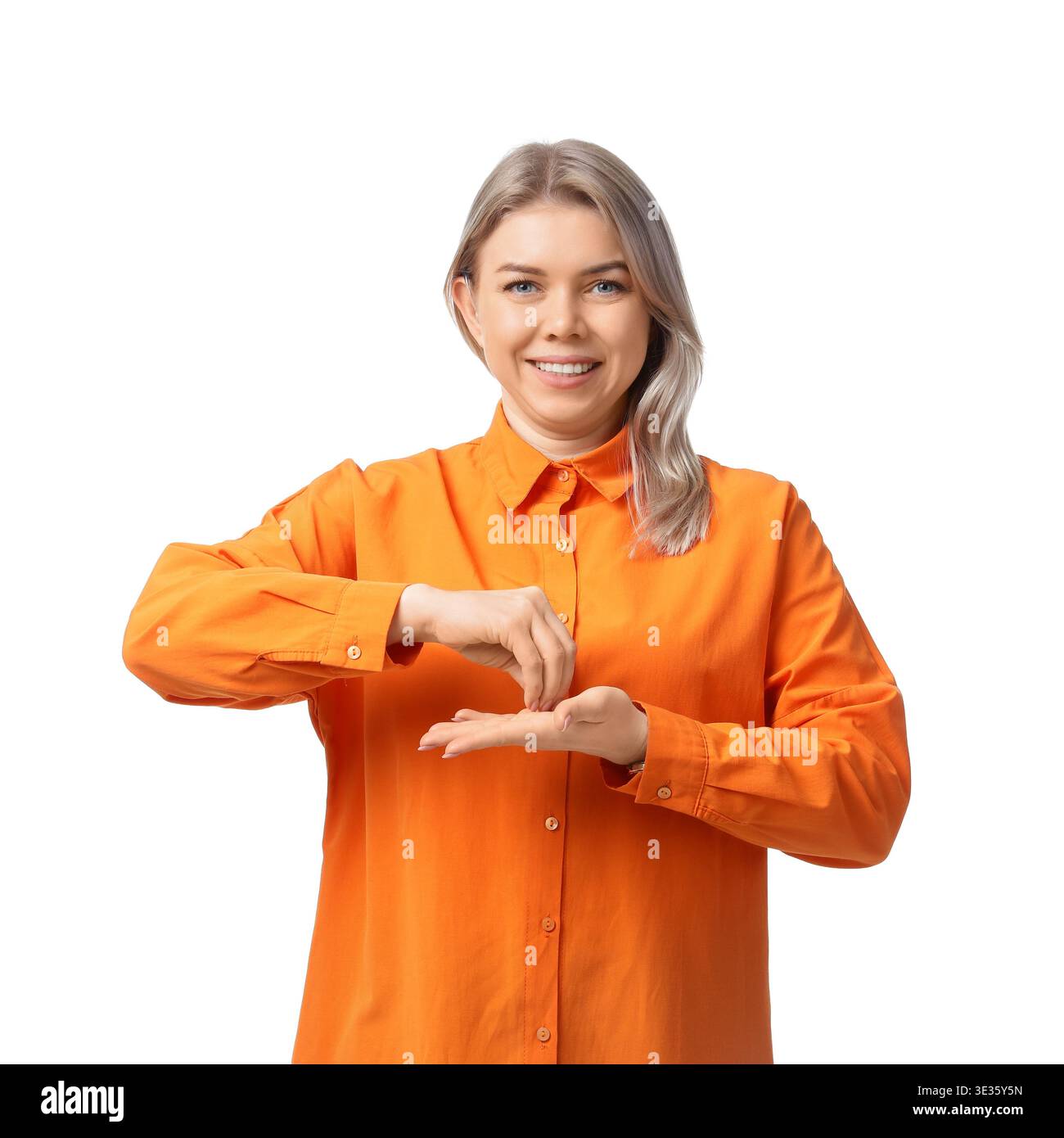 Young businesswoman with hearing aid using sign language on white background Stock Photo