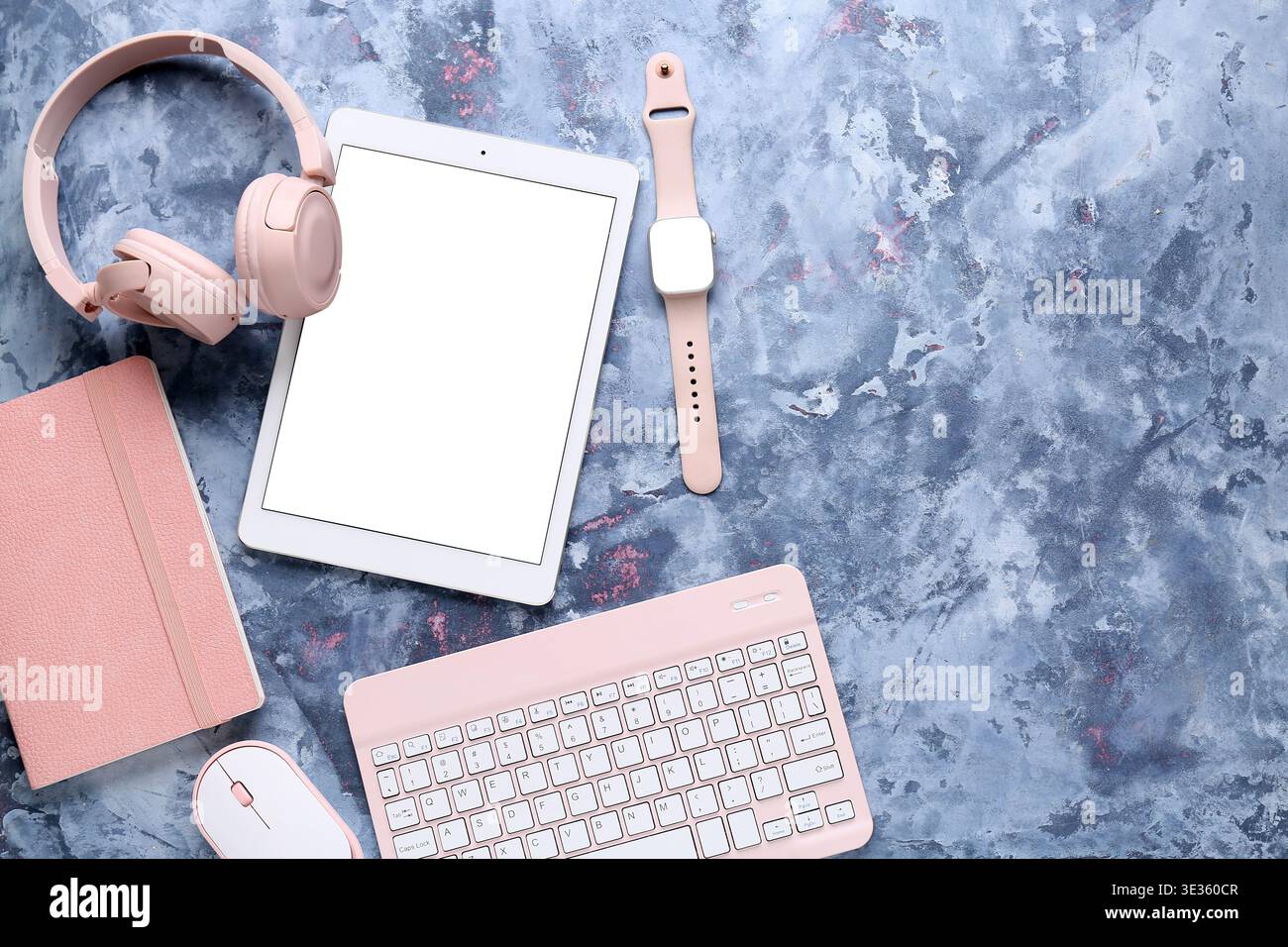 Composition with different modern gadgets and notebook on blue grunge background, closeup Stock Photo