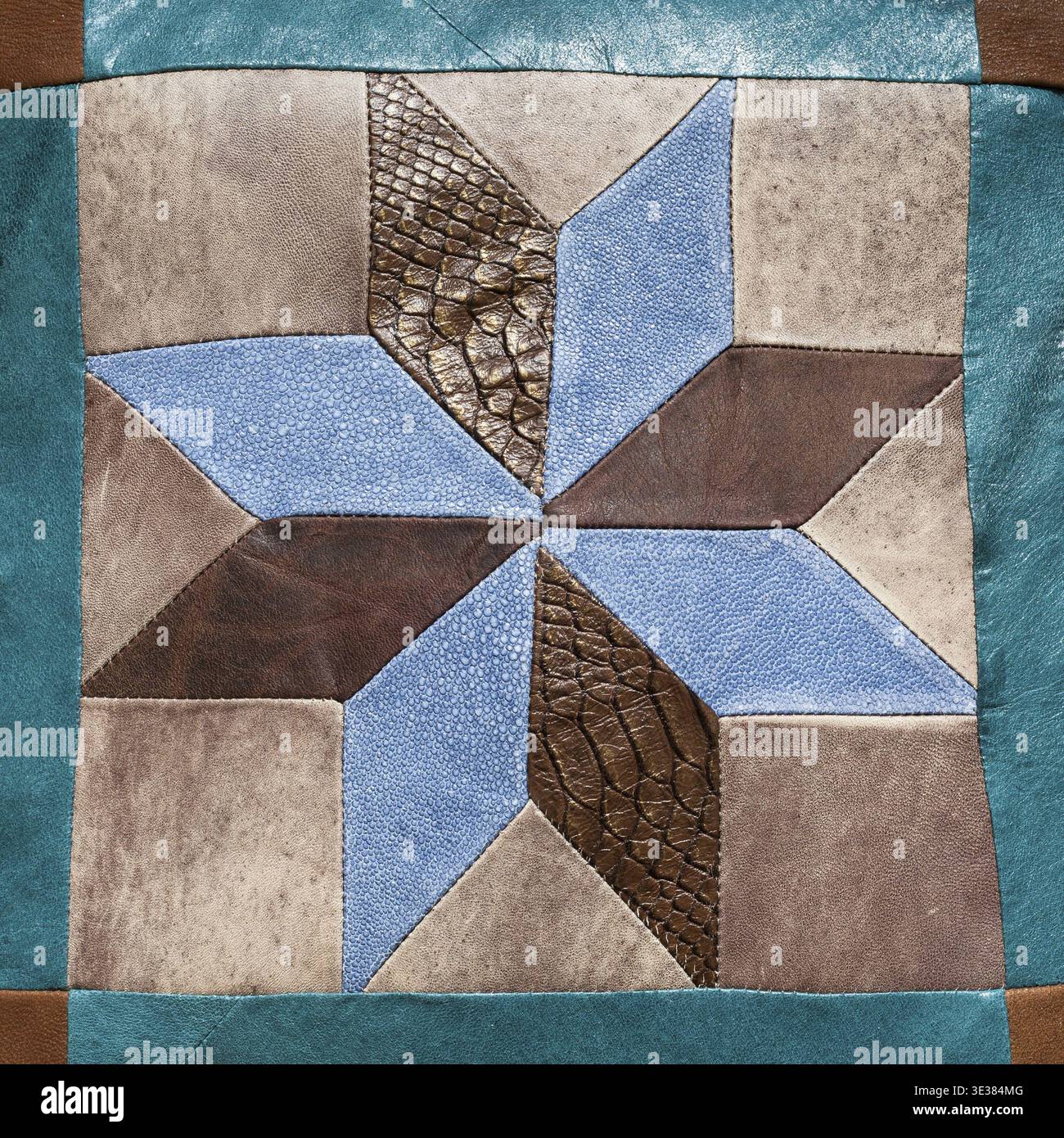 Stitched star pattern from leather pieces on decorative pillow Stock Photo