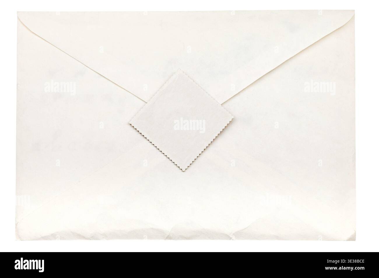 Closed paper envelope sealed by postage stamp isolated on white background Stock Photo
