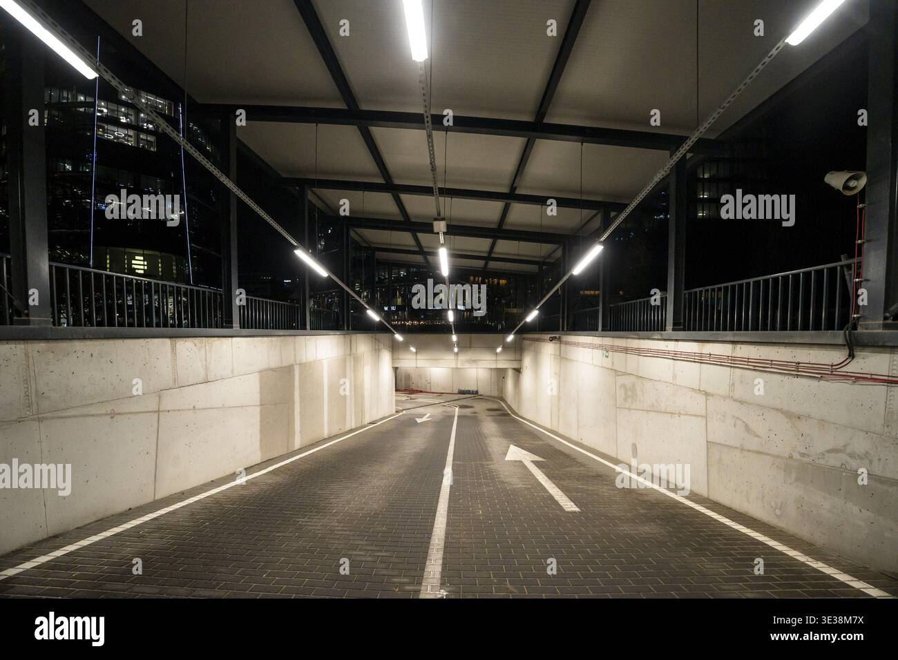 Well-lit underground parking ramp at night in Warsaw, Poland, with ...