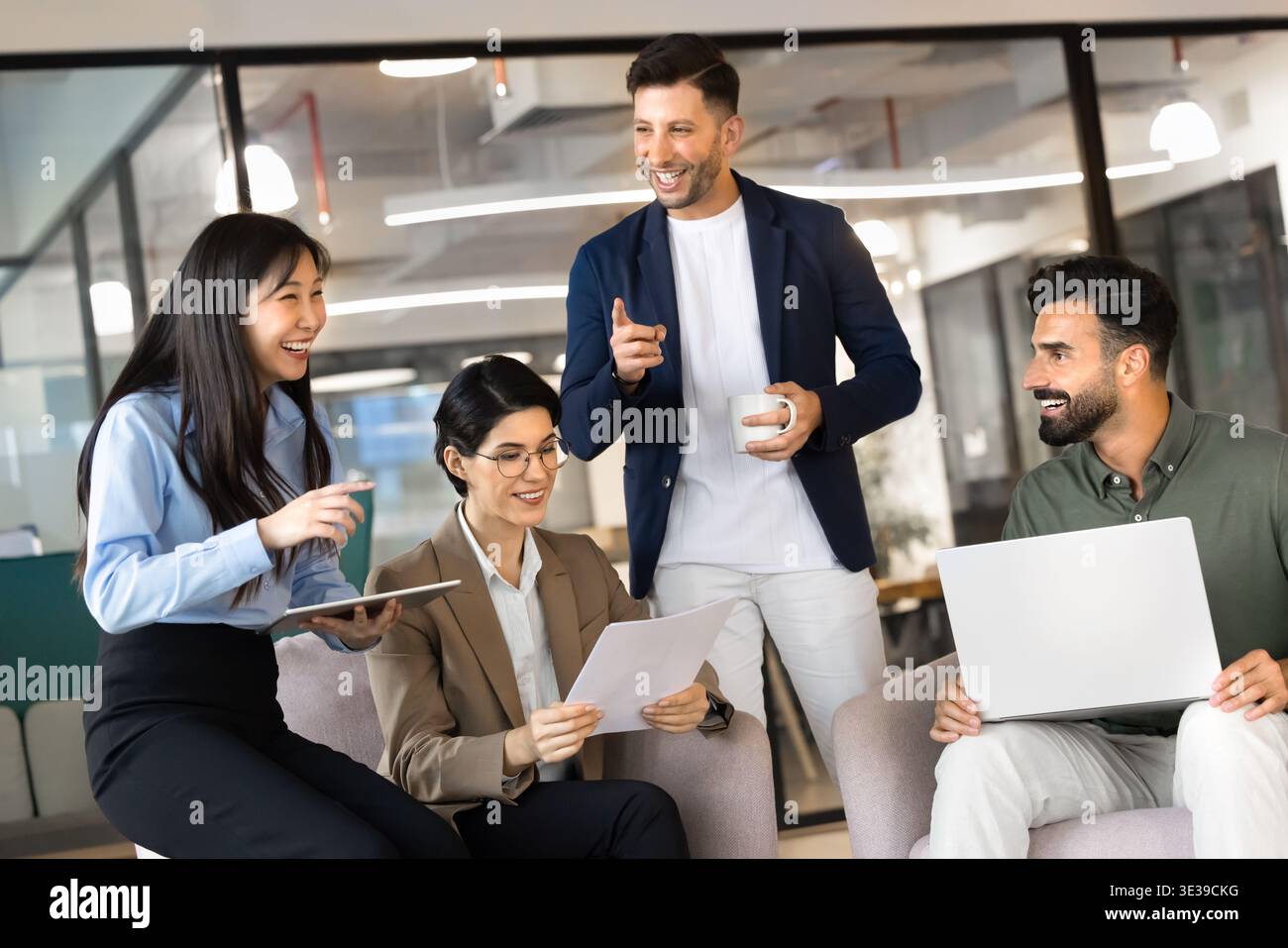 Cheerful multiethnic business team collaborating on project Stock Photo