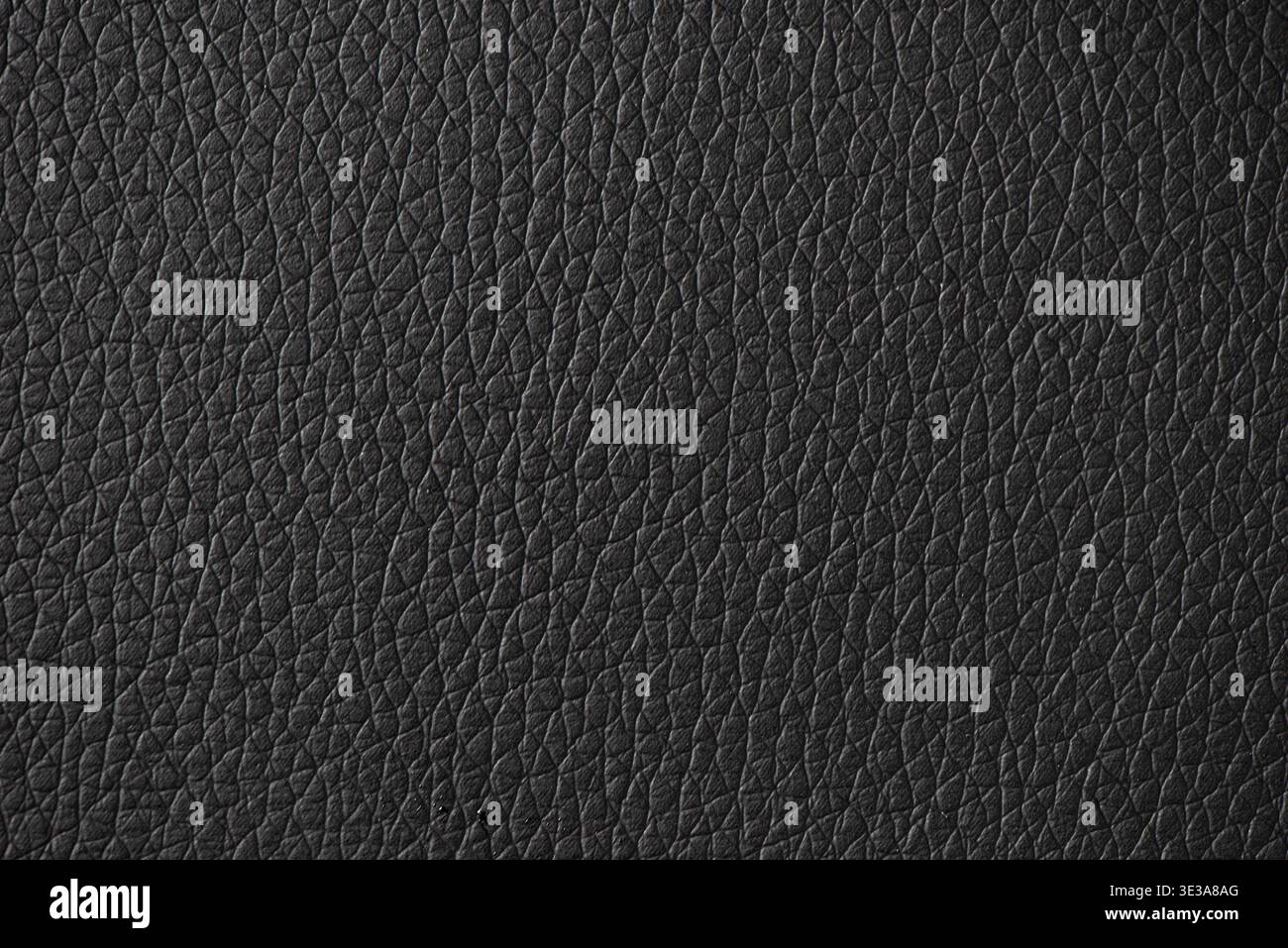 Black leather surface displaying a detailed and textured material background Stock Photo