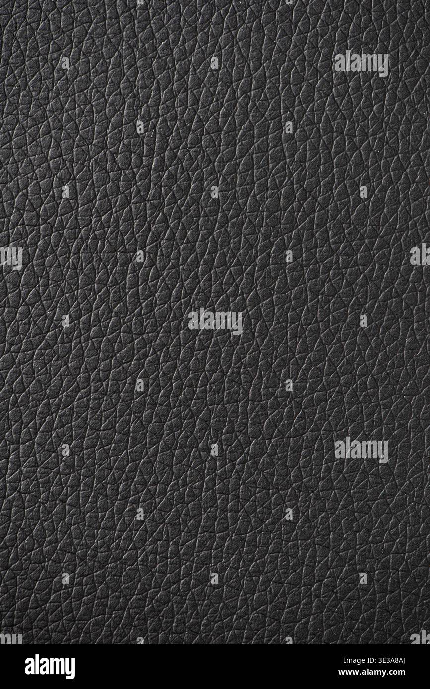 Black leather surface displaying a detailed and textured material background Stock Photo