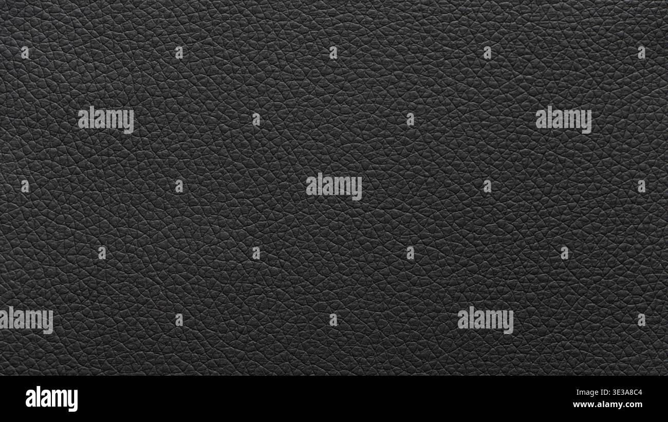 Black leather surface displaying a detailed and textured material background Stock Photo