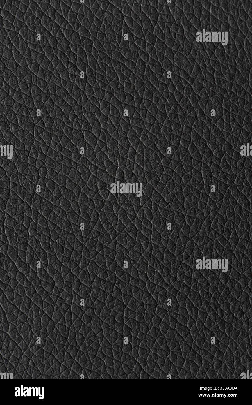 Black leather surface displaying a detailed and textured material background Stock Photo