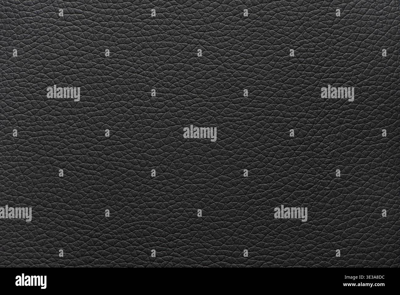 Black leather surface displaying a detailed and textured material background Stock Photo