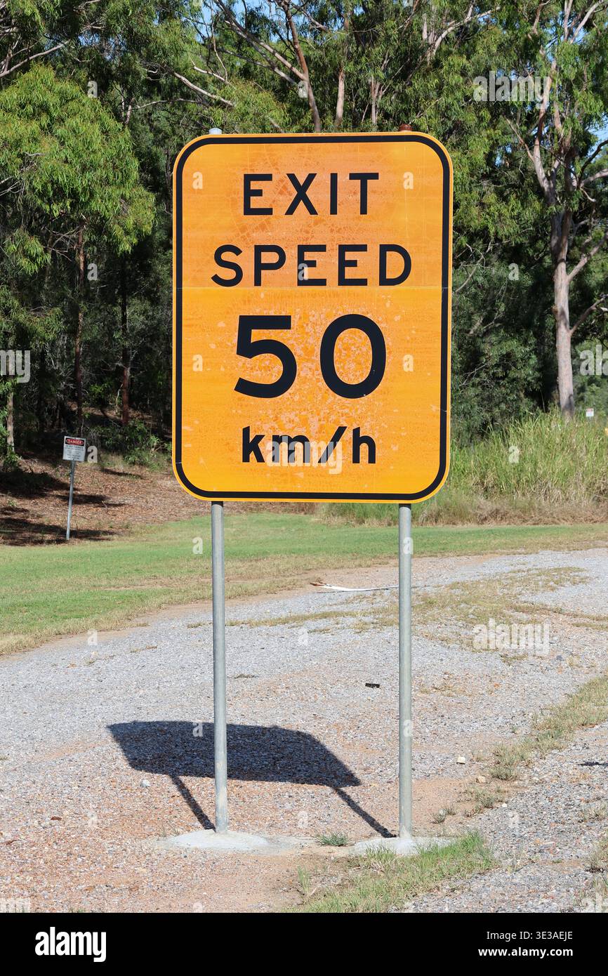Australian exit speed sign 50 km/h on rural roadside with trees in the ...