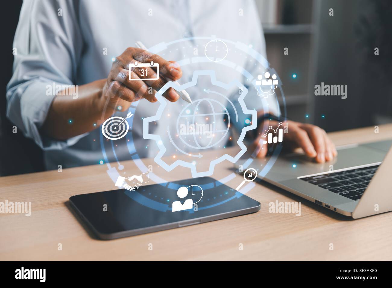 User interacting with global process interface above tablet and laptop, representing business operations, workflow optimization, strategic planning, a Stock Photo