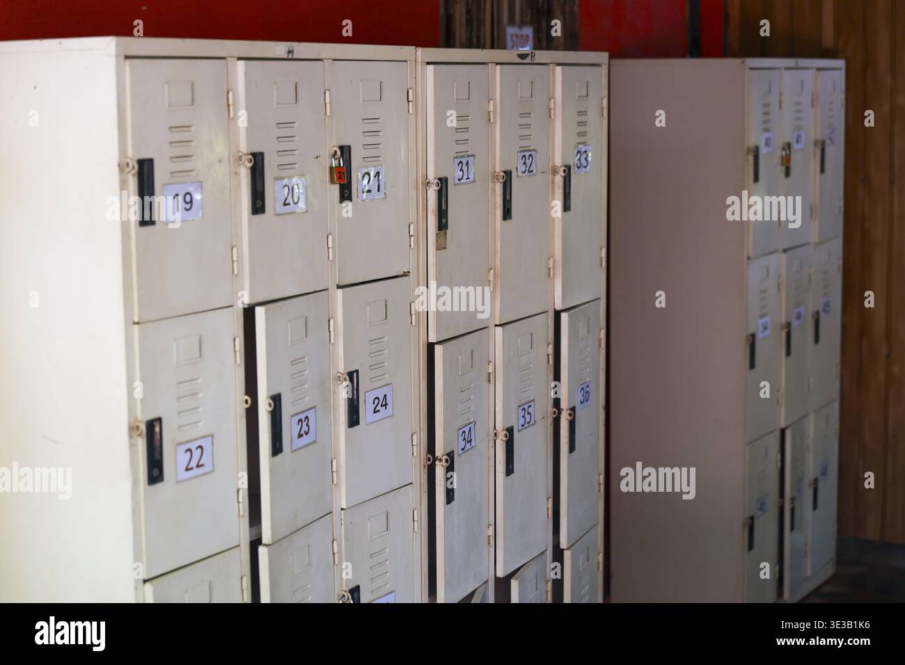 Quiet, orderly row of numbered metal locker units for secure storage in ...
