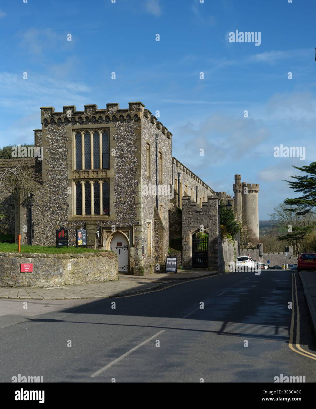 A View down London Road towards the Arundel Castle showing The Priory Playhouse and medieval architecture of the West Sussex market town Stock Photo