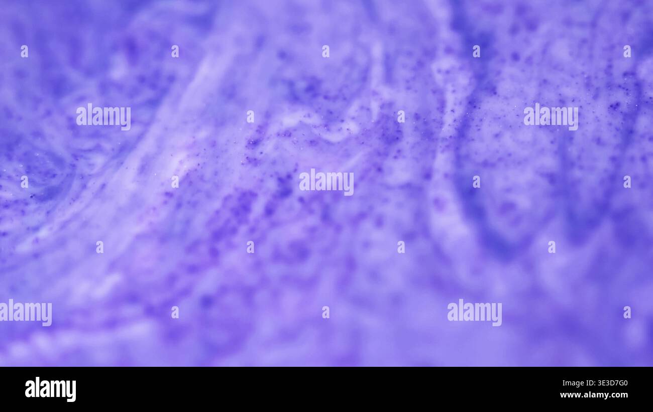 Defocused purple paint color liquid art ink spill Stock Photo