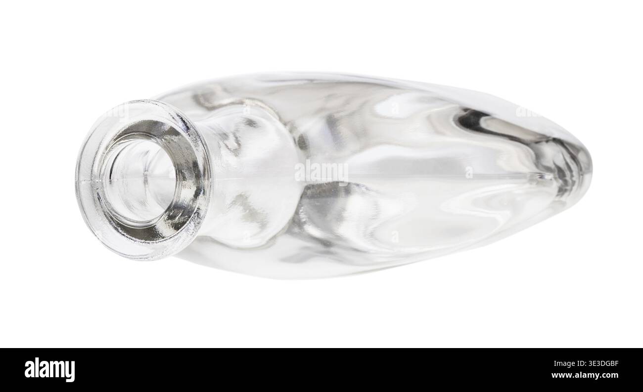 Overturned empty clear cognac bottle against white background Stock Photo