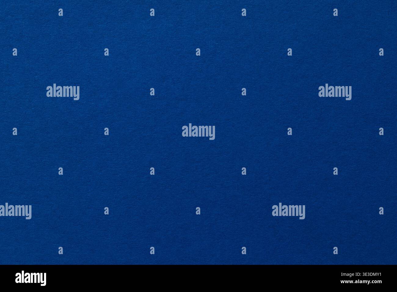 Deep blue textured paper background with copy space for modern design projects Stock Photo
