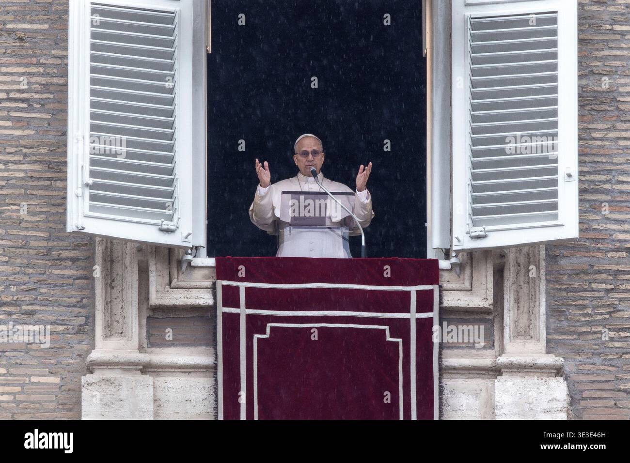 Pope Leo XIV leads the Angelus prayer from the window of his study ...
