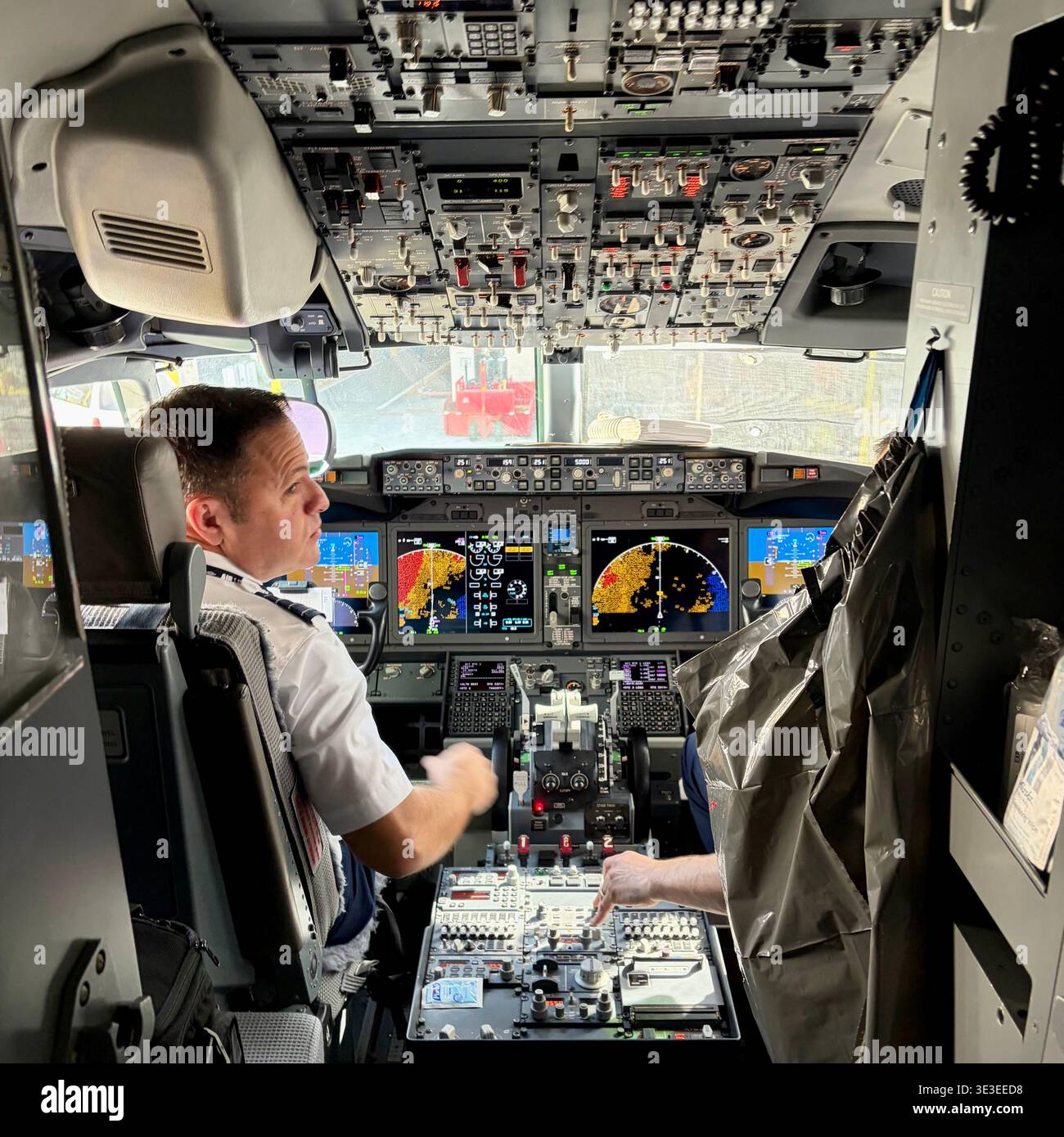 A pilot prepares for takeoff in a jet, Stock Photo