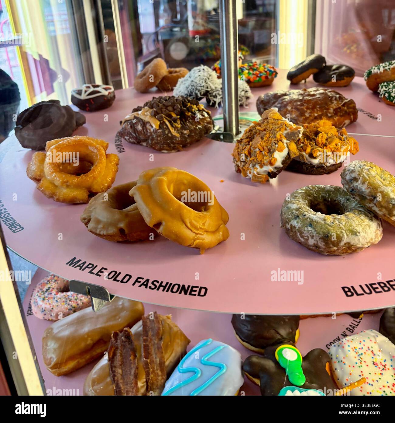 Doughnuts on a circular display. - Smartphone Captured Stock Image