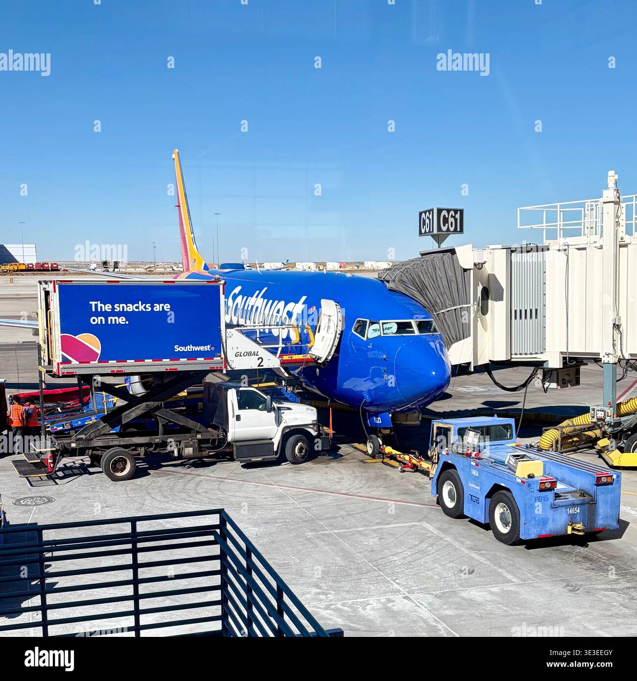 A Southwest Airlines' jet gets serviced while  on the ground. - Smartphone Captured Stock Image