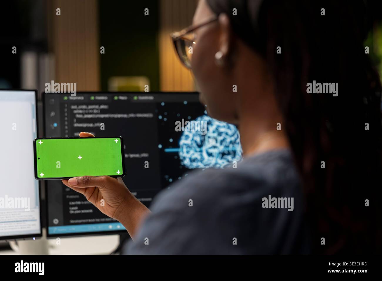 Admin using AI app on isolated screen smartphone to optimize performance and forecast issues. IT expert in tech startup office training deep learning models using mockup mobile phone Stock Photo