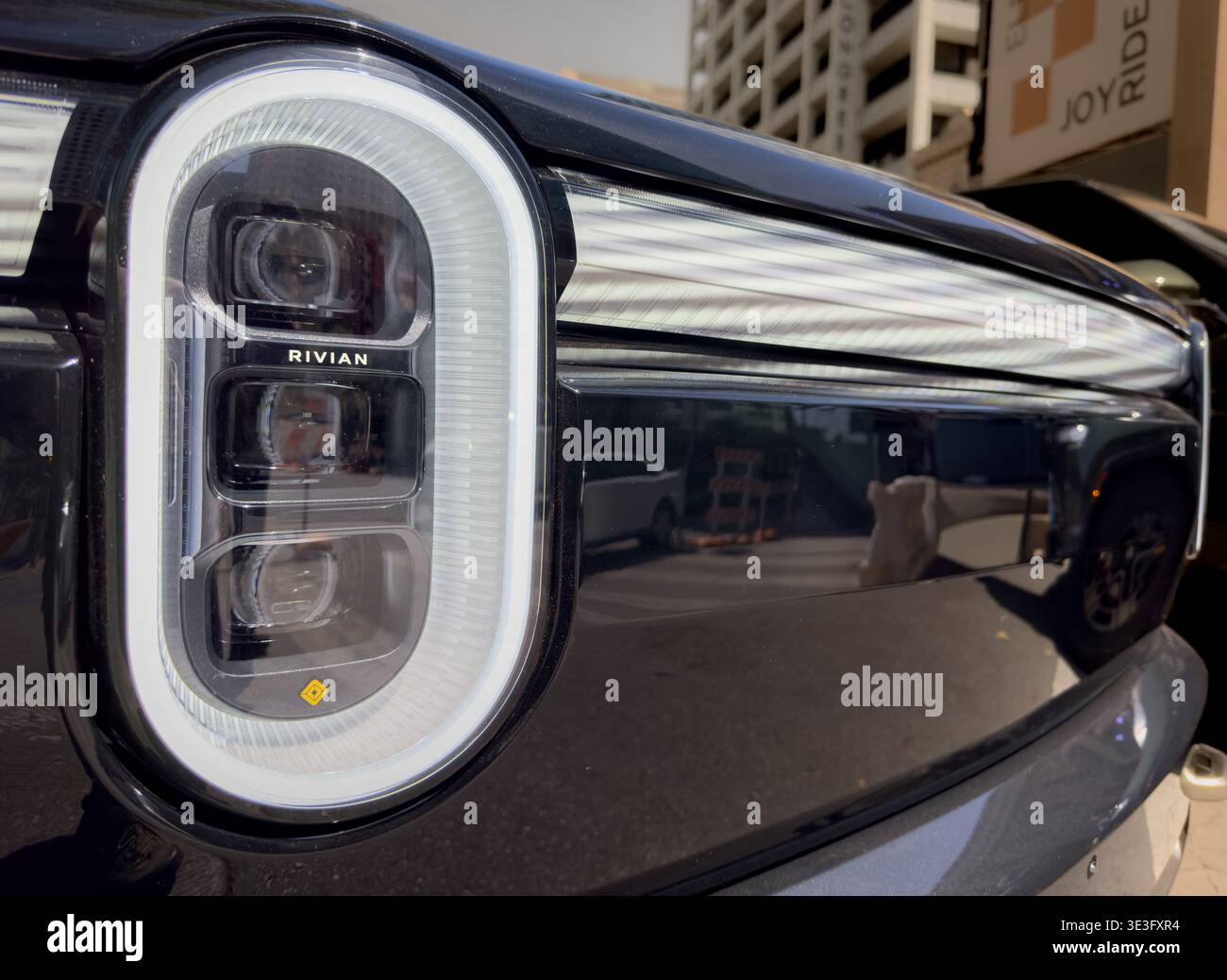 Closeup of Rivian R2 headlights and front end during their display and ...