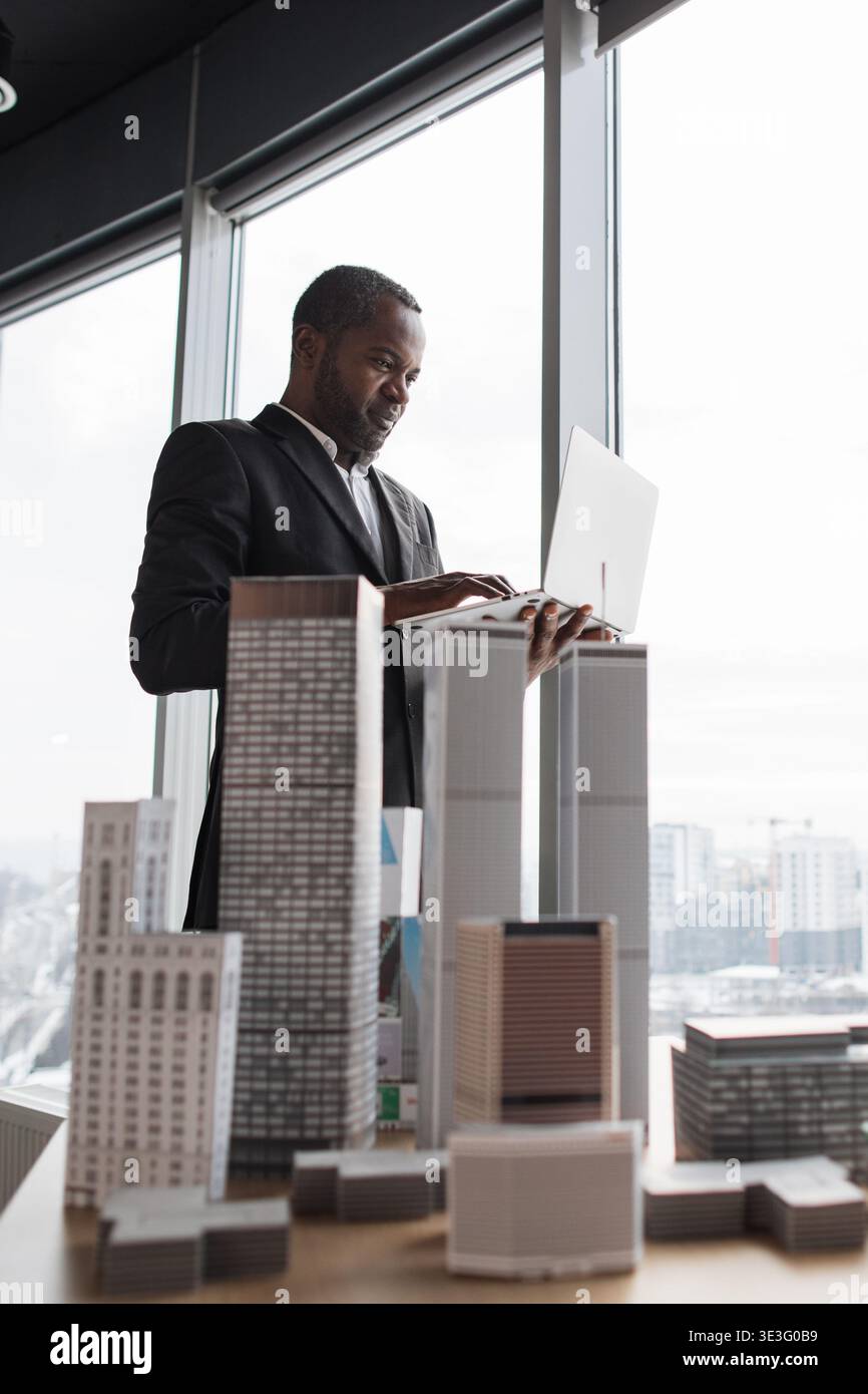 Architect Reviews Building Models Stock Photo