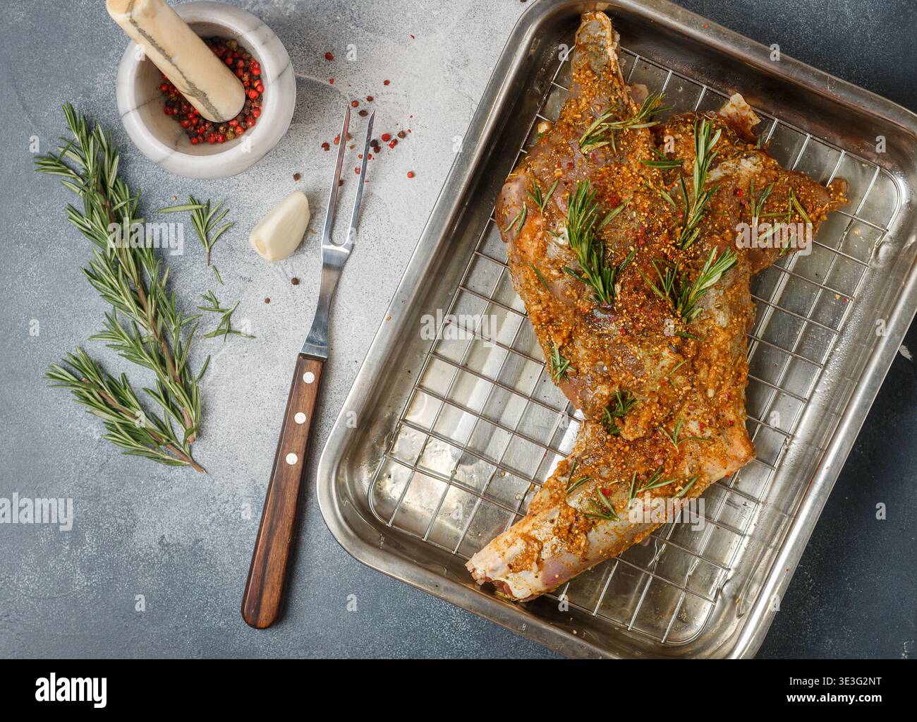 Raw Roe Raw roe deer leg with spices, garlic and rosemary for baking. Delicious ...