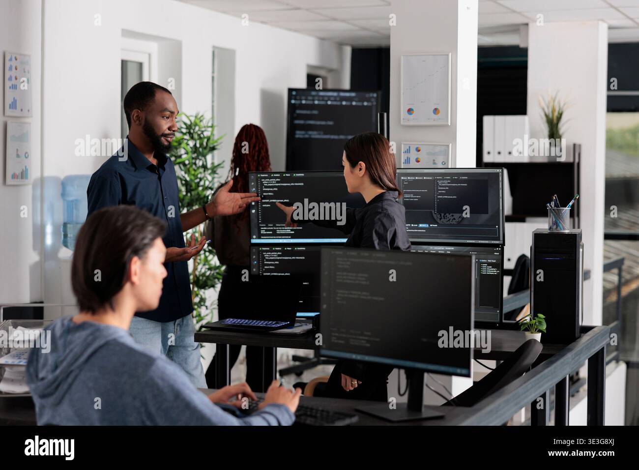 App software developer typing machine learning html code on computer, sitting at desk in it big data office. Cloud programer working on database system with coding script in software company, Stock Photo