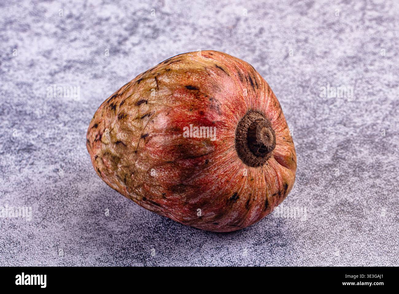 Single ripe exotic cherimoya fruit on a rustic background. Top-down ...