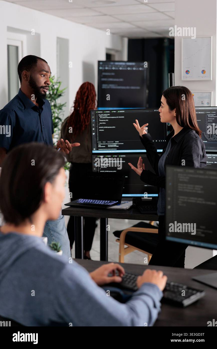 Software developer programming source code algorithm on computer, typing sever data in agency office. Database programer working on new user interface with online system to create algorithm. Stock Photo