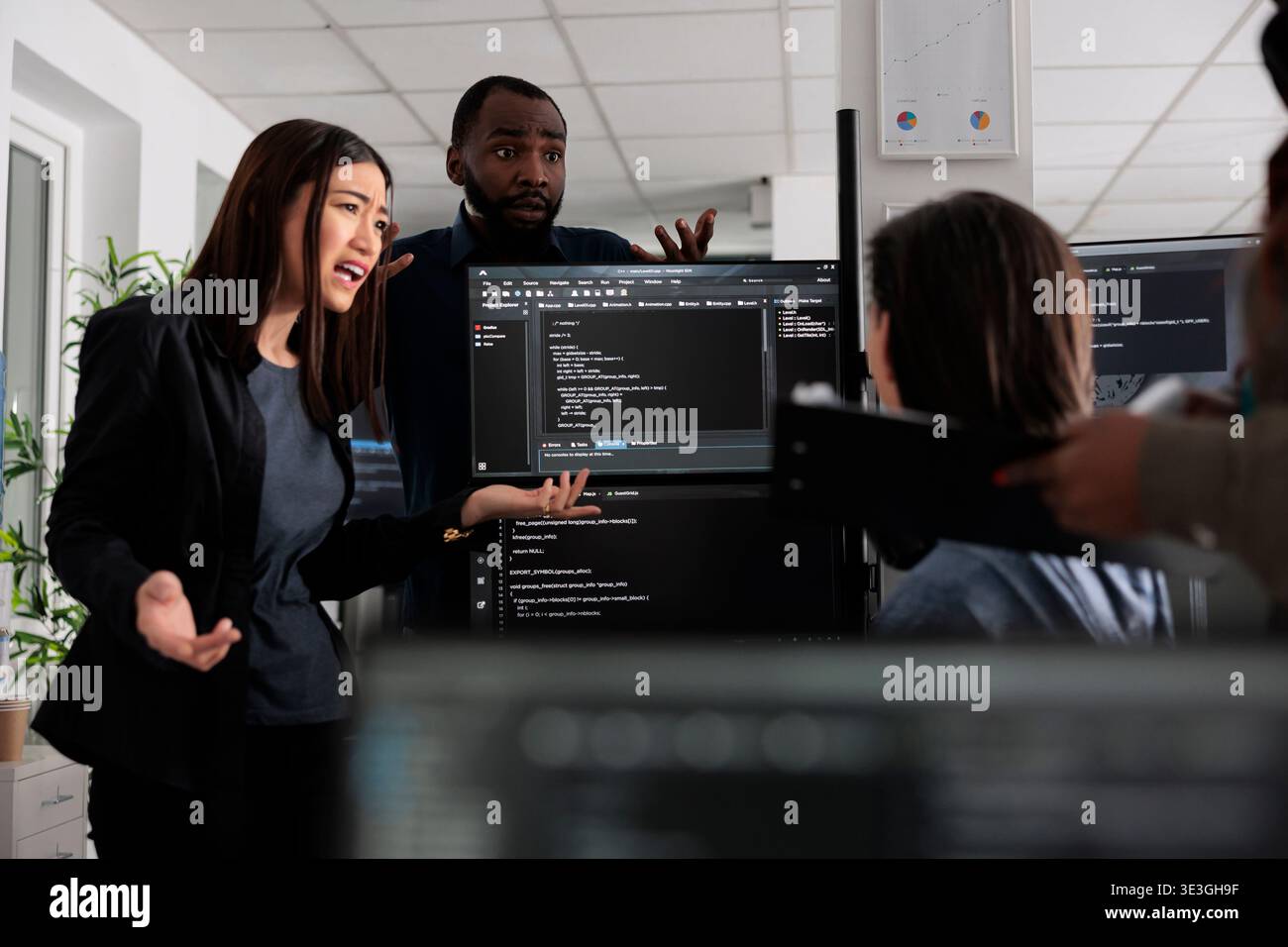 Diverse web developers collaborating about programming project talking about coding algorithm for new cloud computing user interface. team of software engineers running database system code. Stock Photo
