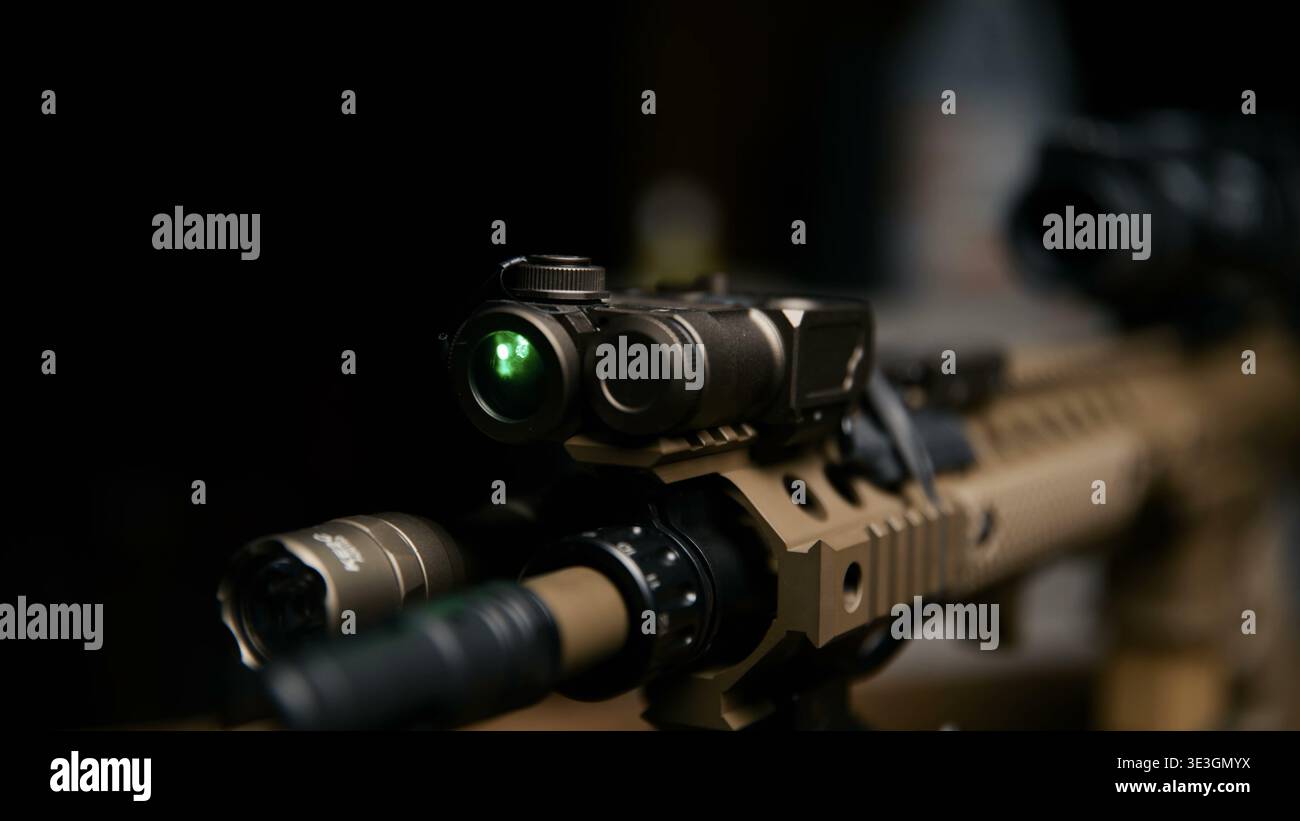Tactical rifle with mounted laser and flashlight attachments Stock Photo