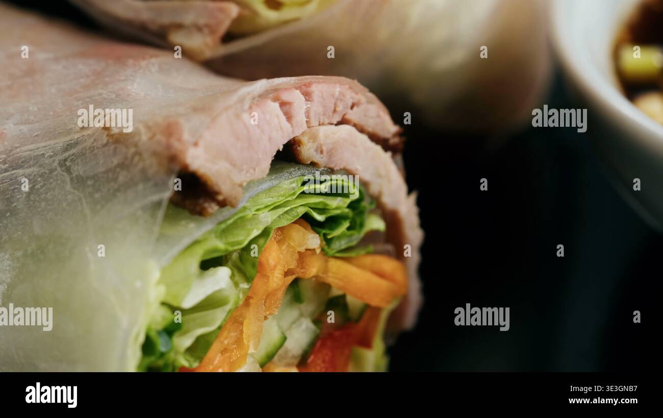Fresh spring rolls with thinly sliced meat and crisp vegetables Stock Photo