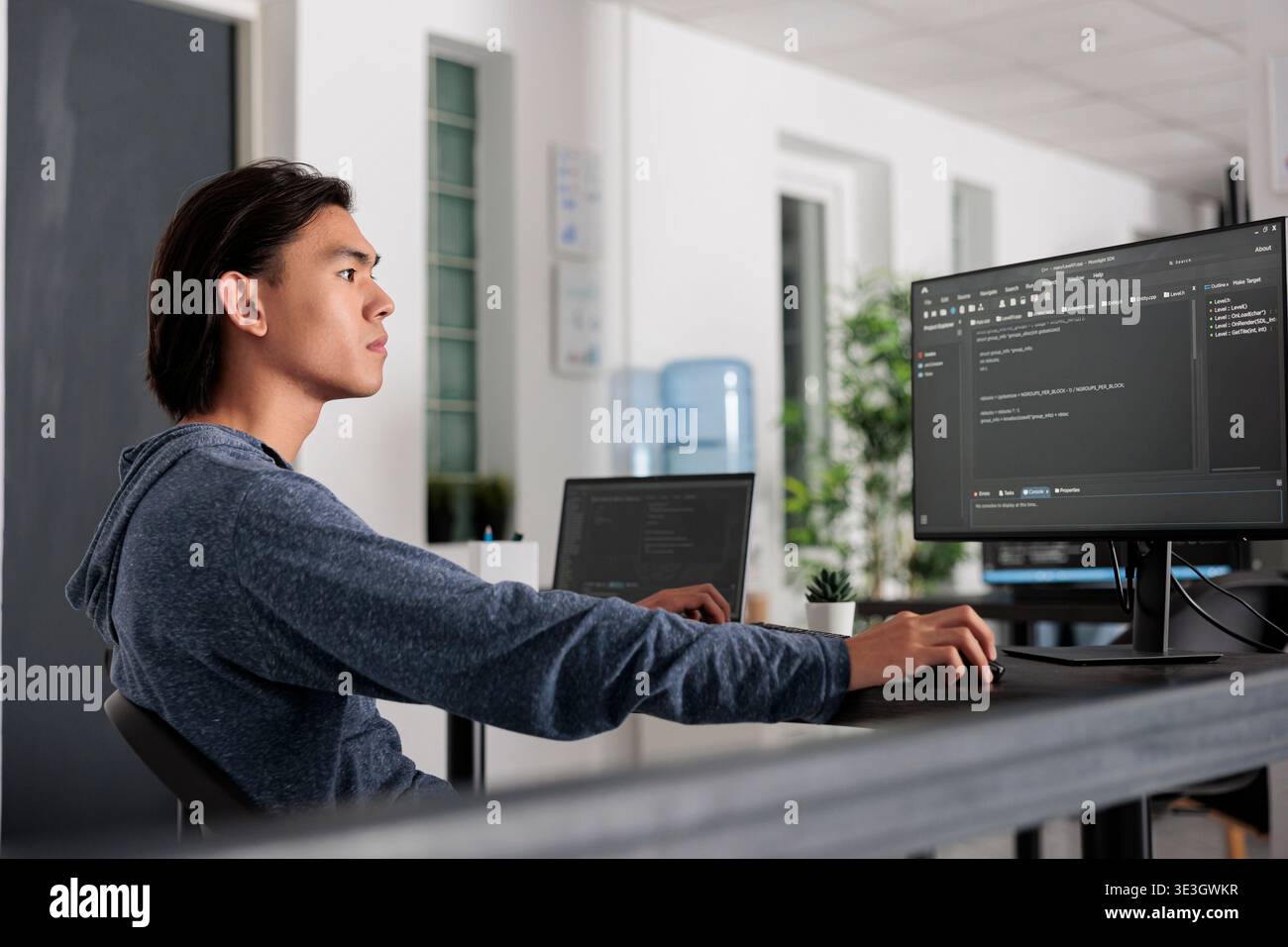 It engineer using programming computer to write html code on terminal window, creating new web interface at desk table. Coder working and parsing system algorithm in big data office, it server. Stock Photo